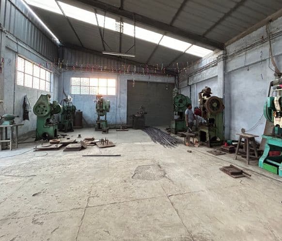 Industrial lathe machine in metalworking shop
