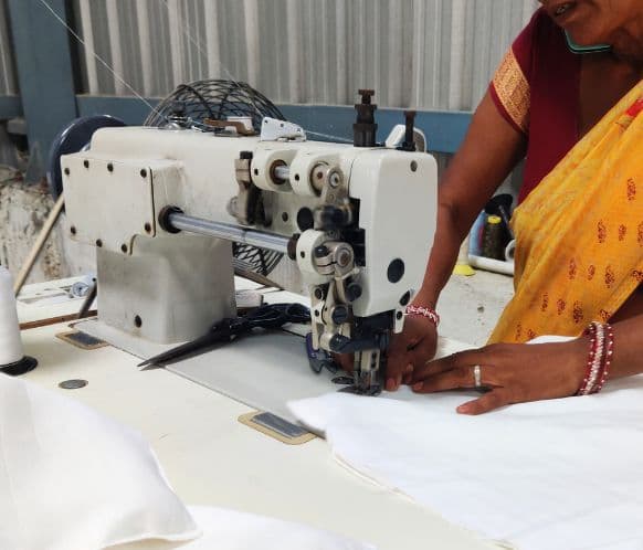 Industrial stitching machine operated by skilled worker